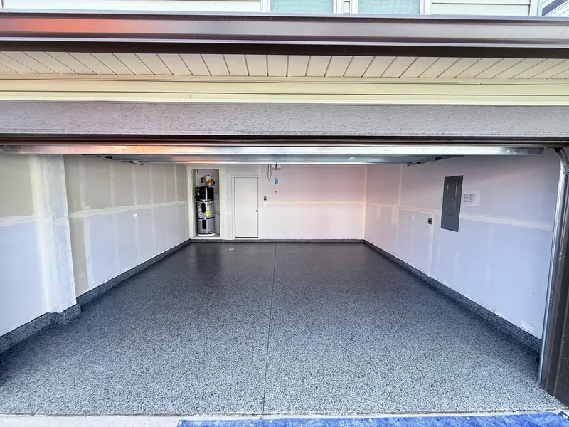 Two-car garage with dark flake polyaspartic floor coating