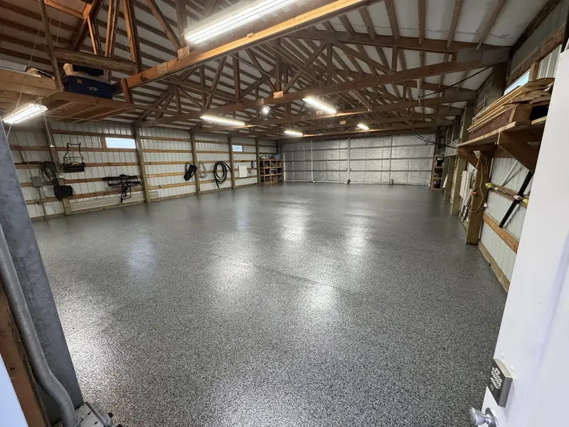 Aviation hangar floor coated with commercial-grade polyaspartic system by Rhino Coatings
