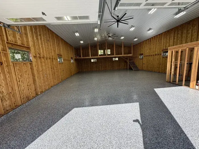 Commercial shop floor with professional polyaspartic coating installed by Rhino Coatings